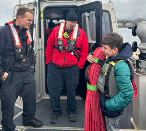 Middle schoolers tour the Newport Fire Boat to learn about careers in the marine industry and power boating safety before getting their power boating license with Sail Newport.